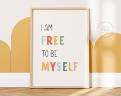 a framed poster with the words i am free to be myself on it