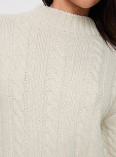 Cable knit sweater  Drop shoulder, ribbed cuff  Good stretch, unlined  Princess Polly Lower Impact  73% reclaimed polyester 24% polyester 3% spandex  Cold hand. wash Stretch Cable Knit Turtleneck, Cozy Knit Cropped Sweater With Ribbed Cuffs, Stretch Turtleneck Cable Knit Sweater, Cream Cable Knit Turtleneck Sweater, Winter Ribbed Stretch Cropped Sweater, Cream Cable Knit Turtleneck, Winter Cable Knit Stretch Turtleneck, Ribbed Stretch Cropped Sweater For Winter, Winter Stretch Cable Knit Turtleneck