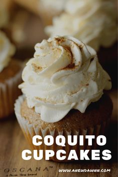 a close up of a cupcake on a wooden table with the words coquito cupcakes above it