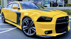 a yellow car parked in front of a store