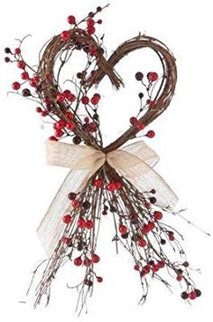 a heart shaped wreath with berries tied to it