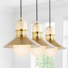 This coastal inspired, linear triple-pendant light has vintage style, dressed up in a brass-gold finish. The metal shades add a bright brass accent, while the frosted glass globes cover the LED bulb for soft, bright light. This versatile fixture with three pendants is perfect over a kitchen island, table, or bar top. JONATHAN Y Colin 35" Adjustable Iron/Glass Retro Hurricane 3-Light Brass Gold Transitional Clear Glass Cone LED Large Hanging Pendant Light Breakfast Nook Lighting, Contemporary Glam, Kitchen Island Linear Pendant, Gold Fixtures, Light Kitchen Island, Kitchen Island Lighting Pendant, Light Kitchen, Kitchen Island Pendants, Linear Pendant