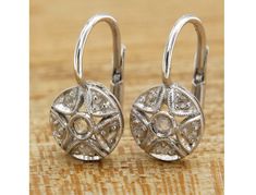 -Lovely dangle earrings made of 14k white gold, circular shaped frame characterized by a star shaped perforated motif, embellished with rose cut diamonds, finely set. Sturdy and practical leverback closure. -Refined and exclusive, these earrings can be a wonderful gift for a special occasion. -Entirely handmade jewel, regularly marked with the gold title (585) and of the Italian manufacturer. -CHARACTERISTICS 14k (585) white gold and 0.16 ctw natural diamonds. Weight: 3.2 grams. Height: 1.7 cm (0.67 inch). Diameter: 0.95 cm (0.37 inch). -The earrings are shipped complete with elegant packaging and warranty. -Any taxes and customs fees are not included in the item price or shipping cost. These charges are the buyer's responsability. -IMPORTANT This product is created entirely by hand by our Fine Jewelry Round Diamond Earrings With Ear Wire, Sterling Silver Diamond Earrings With Lever Back, White Gold Pierced Diamond Earrings, Pierced White Gold Round Diamond Earrings, White Gold Round Diamond Earrings, Round White Gold Diamond Earrings, Round White Diamond Earrings With Lever Back, Wedding Diamond Earrings With Ear Wire, Round Diamond White Diamond Earrings With Lever Back