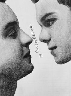 two people are facing each other with their faces close together