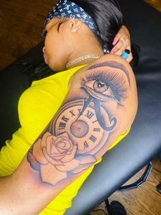 a woman with a clock tattoo on her arm