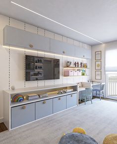 a living room filled with furniture and a flat screen tv mounted to the side of a wall