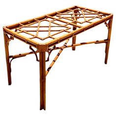 a table made out of bamboo with no top and legs on the bottom, is shown in front of a white background