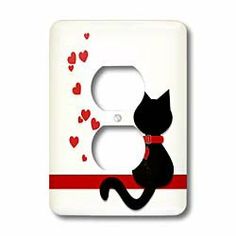 a light switch cover with a black cat on it's side and hearts flying around