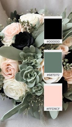 a wedding bouquet with roses and succulents in shades of gray, pink, and black