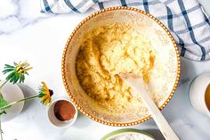 a bowl filled with batter next to other ingredients