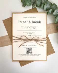 the wedding stationery is tied up with twine