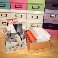 many drawers are stacked on top of each other with file folders in the bottom drawer