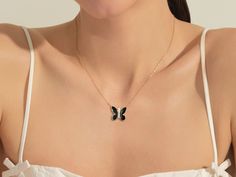 This necklace features a beautifully crafted butterfly pendant made from 14k solid gold and adorned with black enamel, adding bold contrast and contemporary flair—the combination of black enamel, gold, and diamonds results in a sophisticated, modern, and timeless design. FEATURES• Made to Order• Gold Kt: 14k Solid Gold, 18k Solid Gold• Gold Color: Rose Gold, Yellow Gold, White Gold• Available Length Range: 14 Inches - 20 Inches (Custom lengths are also available upon contact)• Available Gemstone Gold Necklace With Black Enamel Oval Pendant, Elegant Black Enamel 14k Gold Necklace, Yellow Gold Butterfly Pendant Necklace In Fine Jewelry, Elegant Black Necklace With Butterfly Charm, Elegant Black Butterfly Charm Necklace, Peach Morganite Ring, Classic Wedding Band, Rutilated Quartz Ring, Signet Ring Men