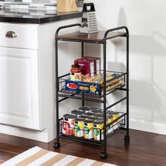 a kitchen cart with food on it next to a counter