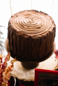 a chocolate cake sitting on top of a wooden table