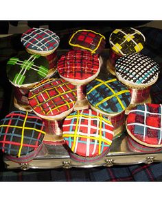 a tray filled with lots of decorated cookies