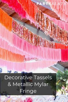 decorative tassels and metallic mylar fringe hanging from the ceiling