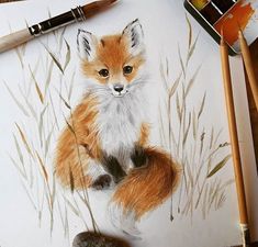 a drawing of a red fox sitting on top of a table next to some paintbrushes