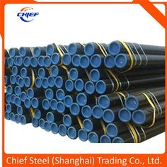 many different types of steel pipes are stacked on top of each other in an orange frame