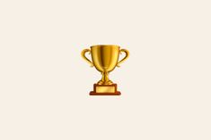 a golden trophy cup sitting on top of a wooden stand