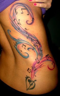 a woman's stomach with musical notes on it