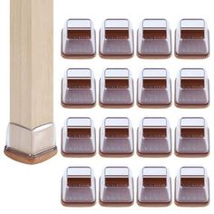 twelve chocolate squares are placed in front of a wooden pole and on top of each other