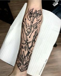 a person with a tattoo on their leg holding a knife and an object in his hand