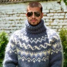 a man wearing sunglasses and a sweater