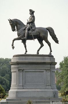 a statue of a man riding on the back of a horse