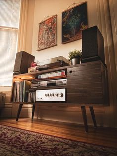 there is a stereo on top of a shelf