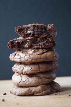 a stack of cookies sitting on top of a wooden table