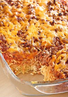 a casserole dish with meat and cheese on top, ready to be eaten