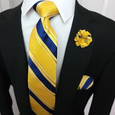 The tie boasts a striking blue and yellow striped pattern that is sure to turn heads. It's made from 100% silk and measures approximately 3.4 inches wide, ensuring a comfortable and stylish fit. The pocket square is a perfect match, with the same blue and yellow stripes adorning its surface. It's the perfect size to add a pop of color to your suit. 100% Silk Handmade Package Includes: Tie, Pocket Square, Cufflinks & Flower Lapel. Length: 59" Width: 3.34" Warm iron if needed Yellow Suit And Tie Accessories For Black Tie Event, Classic Yellow Ties For Office, Tie Ideas, Flower Lapel, Necktie Set, Cufflink Set, Purple Plaid, Stripe Silk, Pink Paisley