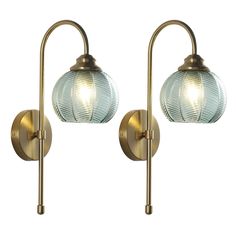 two light wall sconces with glass globes on each arm, one is gold and the other is clear