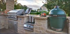 an outdoor kitchen with grill, sink and counter space for cooking food on the grill