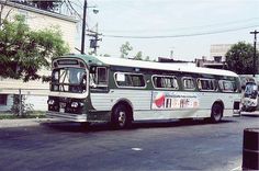 an old bus is parked on the side of the road