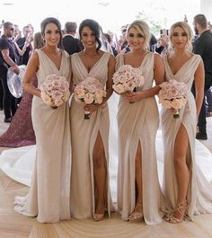 the bridesmaids are all wearing different dresses