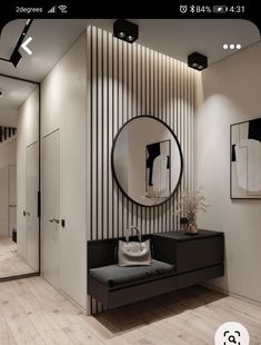 a black and white room with a round mirror on the wall