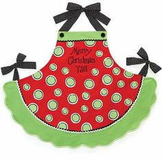 a red and green apron with black polka dots on the front, merry christmas y'all