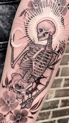 a man with a skeleton tattoo on his arm