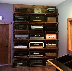 the room has many old radio's in it, including one that is on top of a shelf