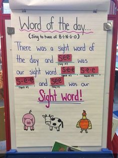 a bulletin board with words written on it and pictures of farm animals in the background