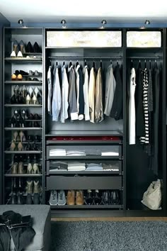 an organized walk in closet with clothes and shoes