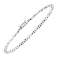 A fabulous bracelet that is a classic piece needed in everyones jewelry collection! Round-cut diamonds line this link tennis bracelet that total 1 ct and is crafted in 10K white gold. Piece measures 7 inches in length and features a box clasp with tongue and safety. 1 cttw Round-cut diamonds G-I color, I3 clarity 10K white gold Measures 7 inches in length Box clasp with tongue & safety Welry Our eBay Store About Us Contact Us Add to Favorite Sellers Welry 1 cttw Diamond Tennis Bracelet in 10K Wh Flexible White Gold Classic Bracelets, Classic Flexible White Gold Bracelets, Classic Sterling Silver Jubilee Bracelet, Classic White Gold Jubilee Bracelet, Classic Chain Bracelet With Diamond Accents, Diamond Tennis Bracelet, Box Clasp, Gold Piece, Fine Jewelry Bracelets