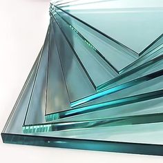 several pieces of glass stacked on top of each other in the shape of pyramids