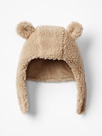 a teddy bear hat is hanging on the wall