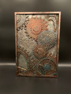 an artistic metal art piece with gears on it