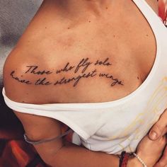 a woman with a tattoo on her chest that says, there are only two things wrong