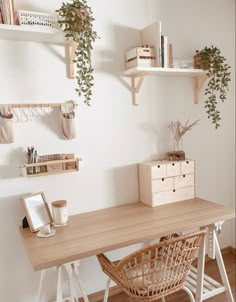 a wooden desk topped with lots of shelves filled with plants