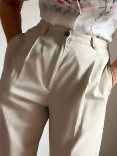 "Quality Vintage 80s Highrise classic pleated pants in a light beige tone.  Pleated front, two deep side pockets and attached back pocket. Bootcut style. Fastens with button and front zipper. Perfect with your favorite heels or flats. Or as shown in the picture, with your favorite boots. Classy and sophisticated vintage trousers that will never go out of style.  Best fits M depending on desired drape. Tag reads 100% cotton, Size 12L, Made in USA. Please refer to measurements.  Shown in 5'8\", 38 Beige Pleated Wide Leg Bottoms, Beige Pleated High-waist Bottoms, Beige High-waist Pleated Bottoms, Chic Pleated Beige Bottoms, High-waisted Pleated Beige Bottoms, High Waist Pleated Beige Bottoms, High-waist Bottoms With Pressed Crease For Spring, High Waist Bottoms With Pressed Crease For Spring, Beige Pleated Straight Pants